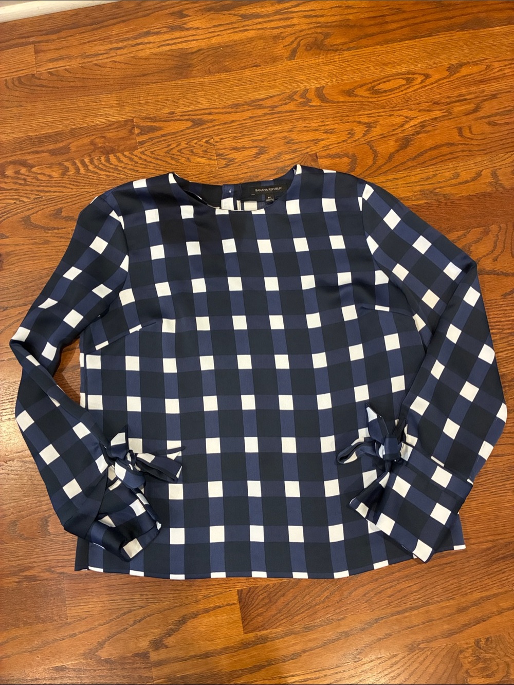 Banana Republic navy and white blouse with bows on sleeve size medium